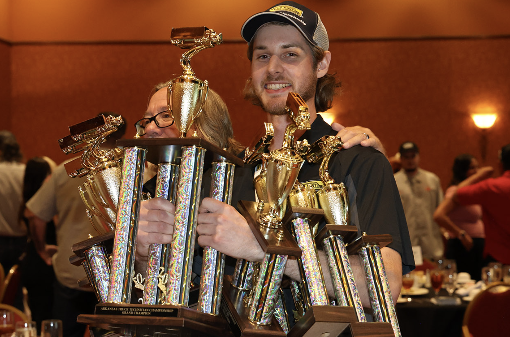 Technician with numerous trophies